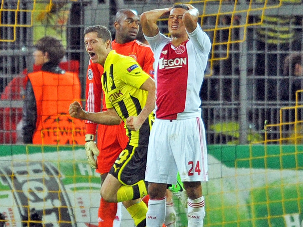 Robert Lewandowski (left) won the game late on for Dortmund