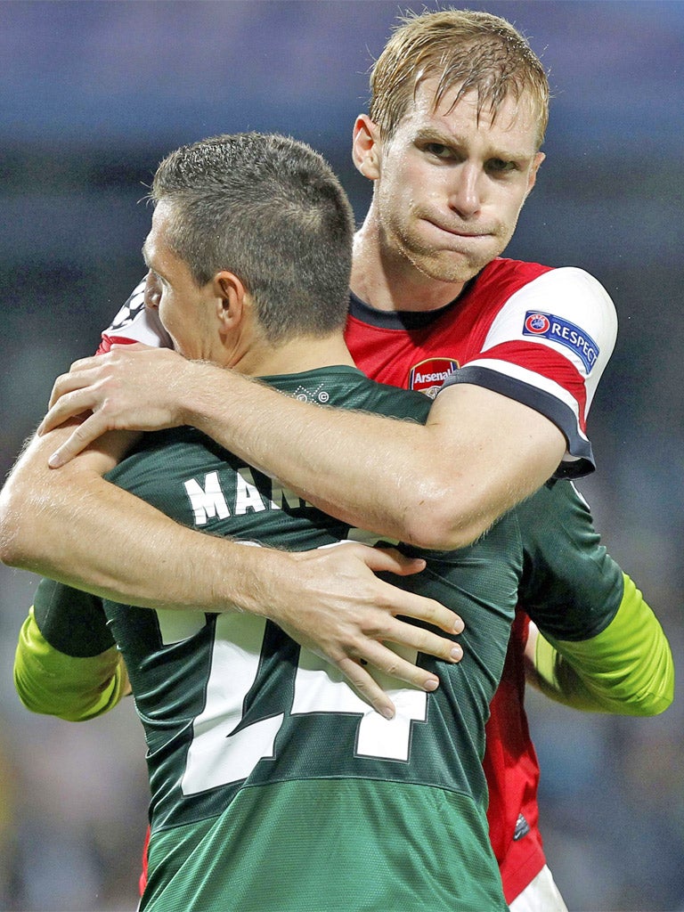 Vito Mannone is embraced by Per Mertesacker after Tuesday night's victory