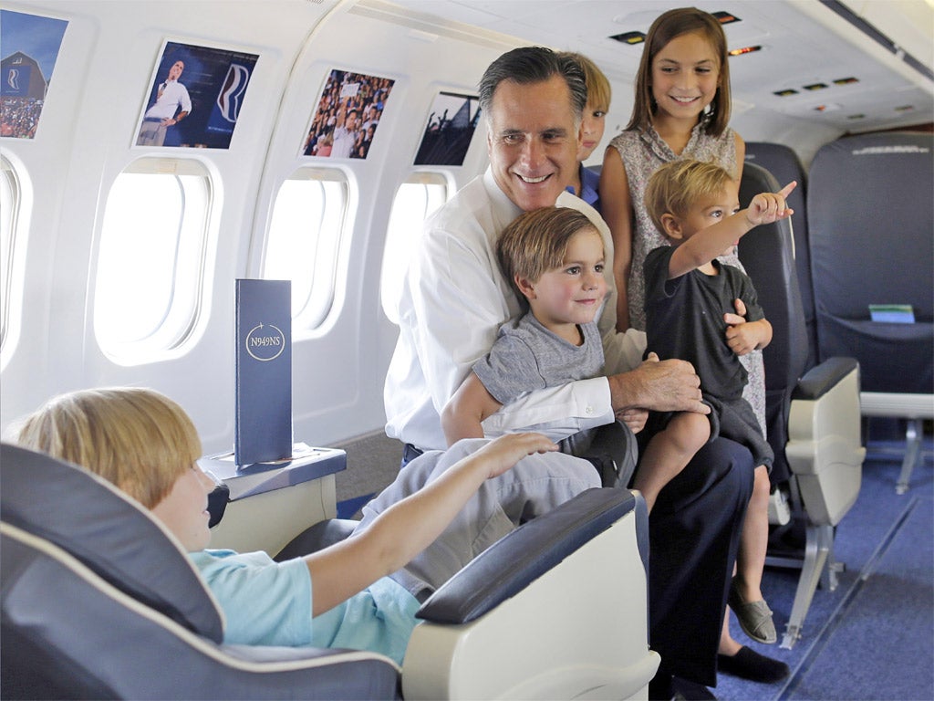 Mitt Romney with his grandchildren on his campaign plane on Tuesday