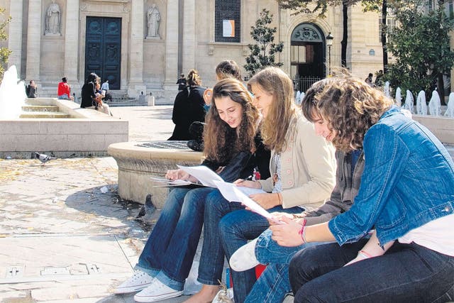 Students compare notes near Sorbonne University in Paris