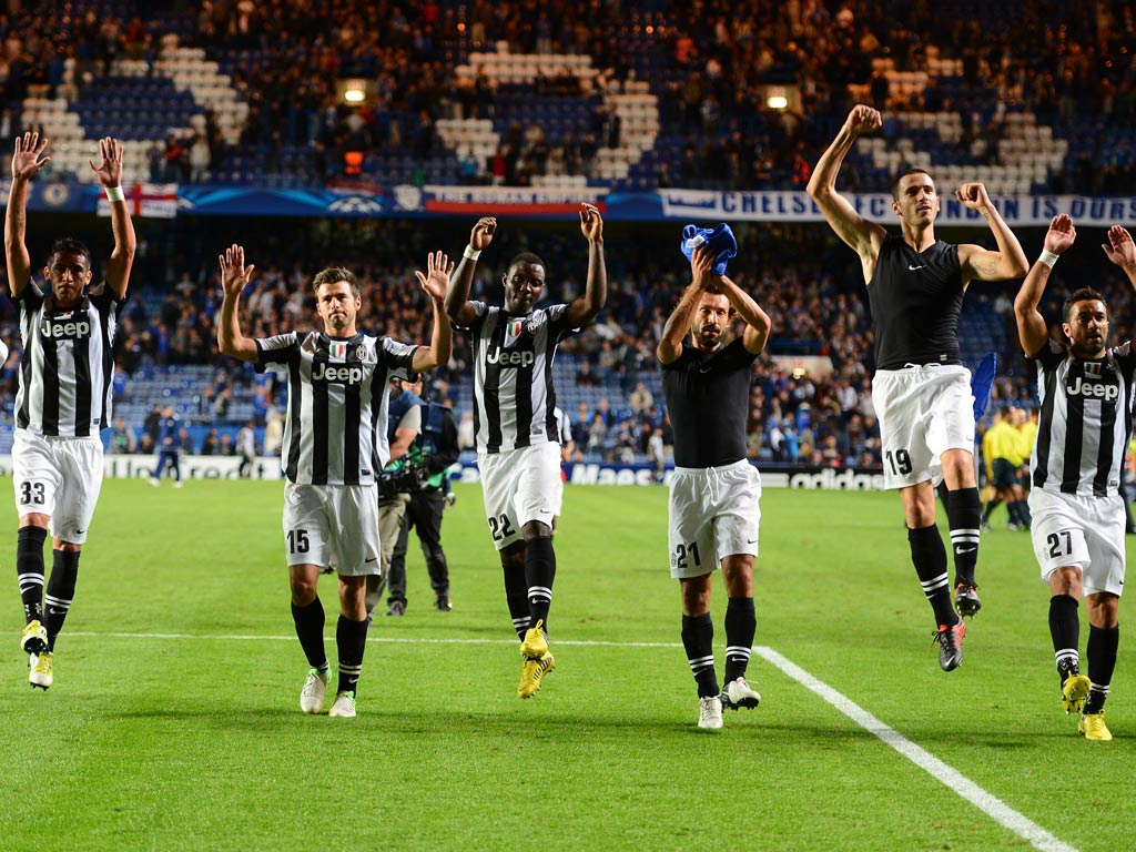 Juventus celebrate their draw against Chelsea