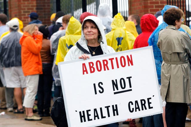 A woman protests against abortion.