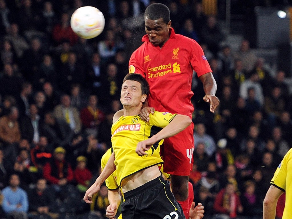Andre Wisdom of Liverpool heads in the second goal