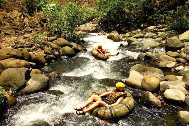 Roll with it: tubing in the river near the Hacienda Guachipelín