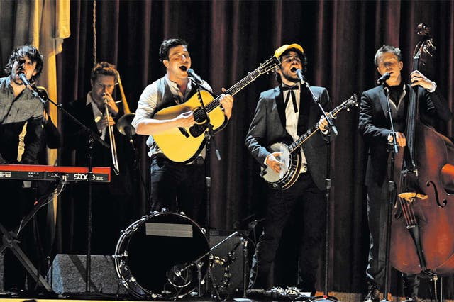 The high life: Ben Lovett, Marcus Mumford, Winston Marshall, and Ted Dwane of Mumford and Sons on stage during this year’s Grammy awards Awards in Los
Angeles