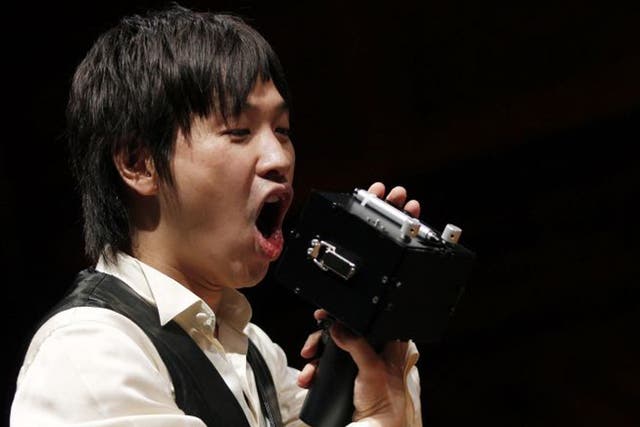 Koji Tsukada demonstrates the "Speech Jammer" after winning the 2012 Ig Nobel Acoustics Prize for creating the machine that disrupts a person's speech by making them hear their own words at a delay