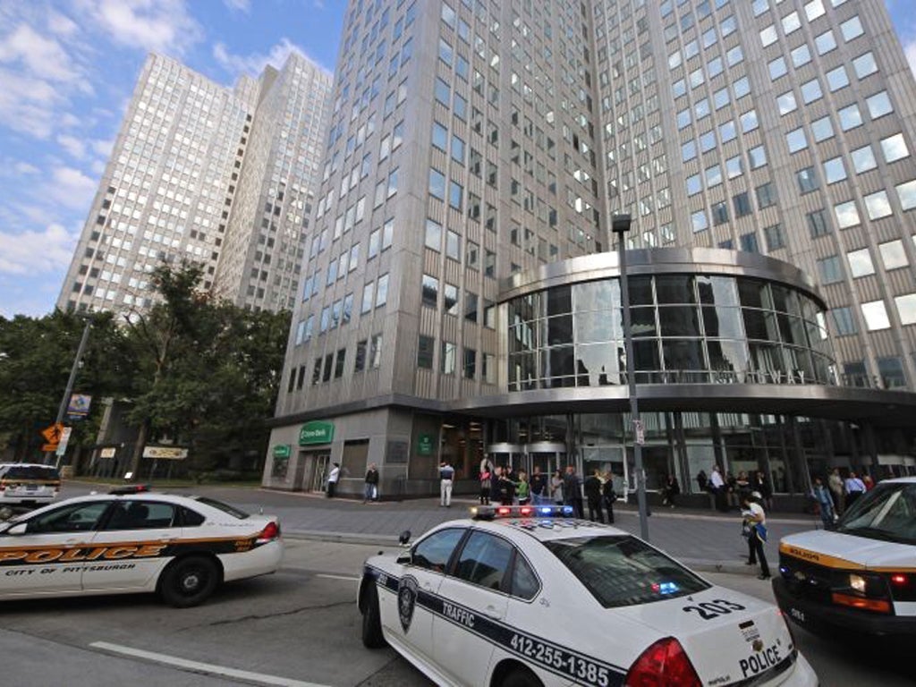 Police block off the area around Three Gateway Center building during the hostage situation