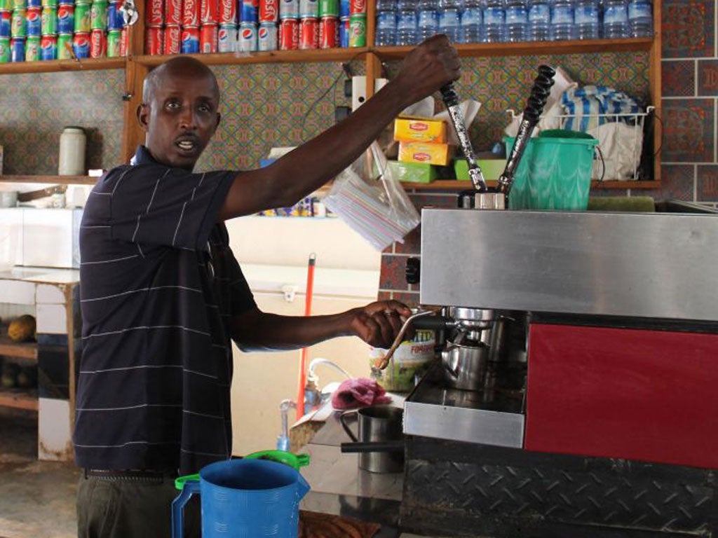 Ahmed Jama in his Village Café, which was blown up this week