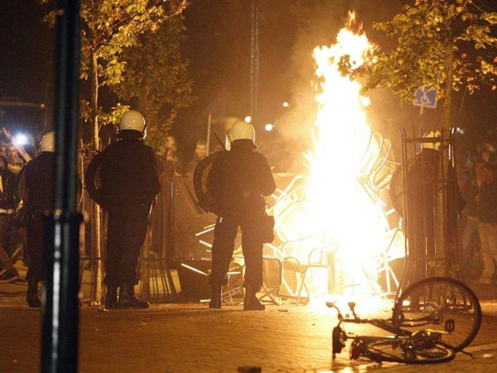 Riot police brake up crowds of youths who turned violent in the northern Dutch town Haren
