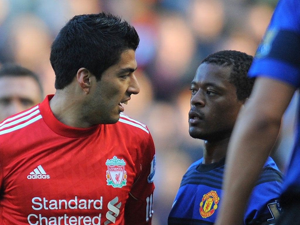 There has been tension between the two players since Suarez (left) racially abused Evra