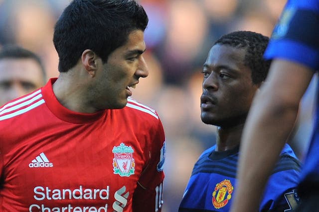 There has been tension between the two players since Suarez (left) racially abused Evra