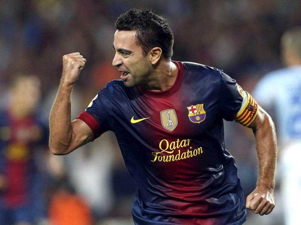 Xavi celebrates his goal against Granada
