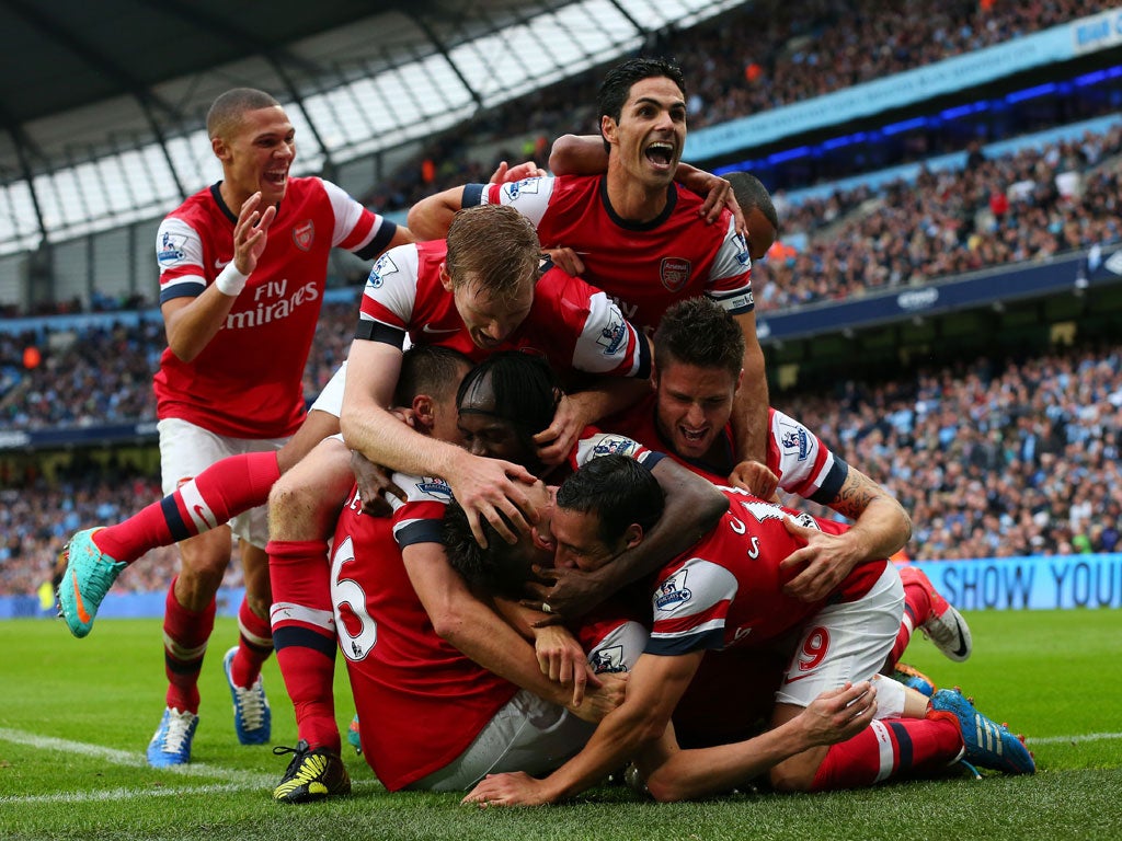 The Arsenal team celebrate their late equaliser