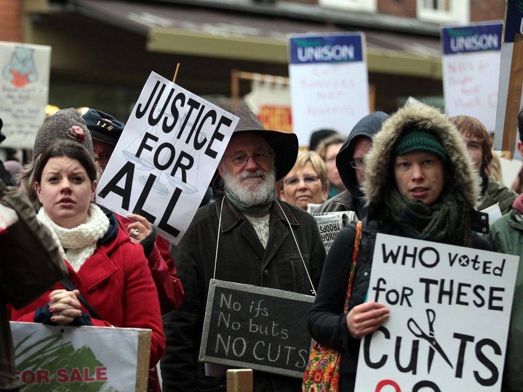 GLOUCESTER, ENGLAND - NOVEMBER 20: Protesters from the gather in front of the steps of the Shire Hall