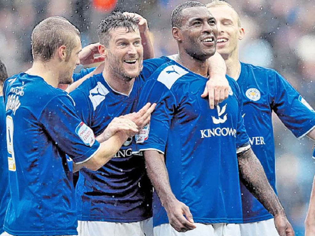 David Nugent (second left) celebrates his second goal against Hull yesterday