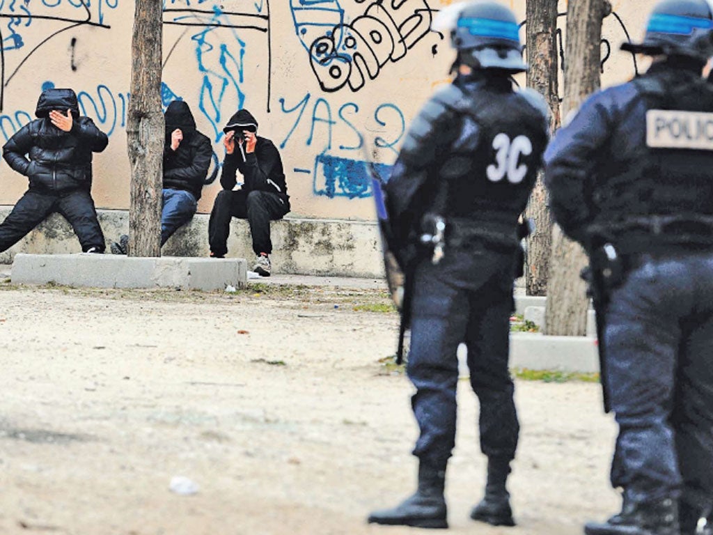 Police try to maintain order in the troubled and poverty-stricken
suburbs of Marseille, the poorest city in France