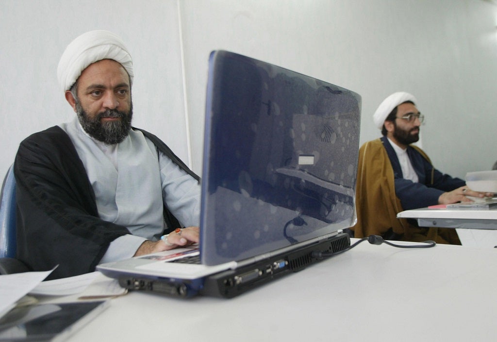 Iranian clergyman Nematollah Daneshmand (L), webmaster for saneei.org