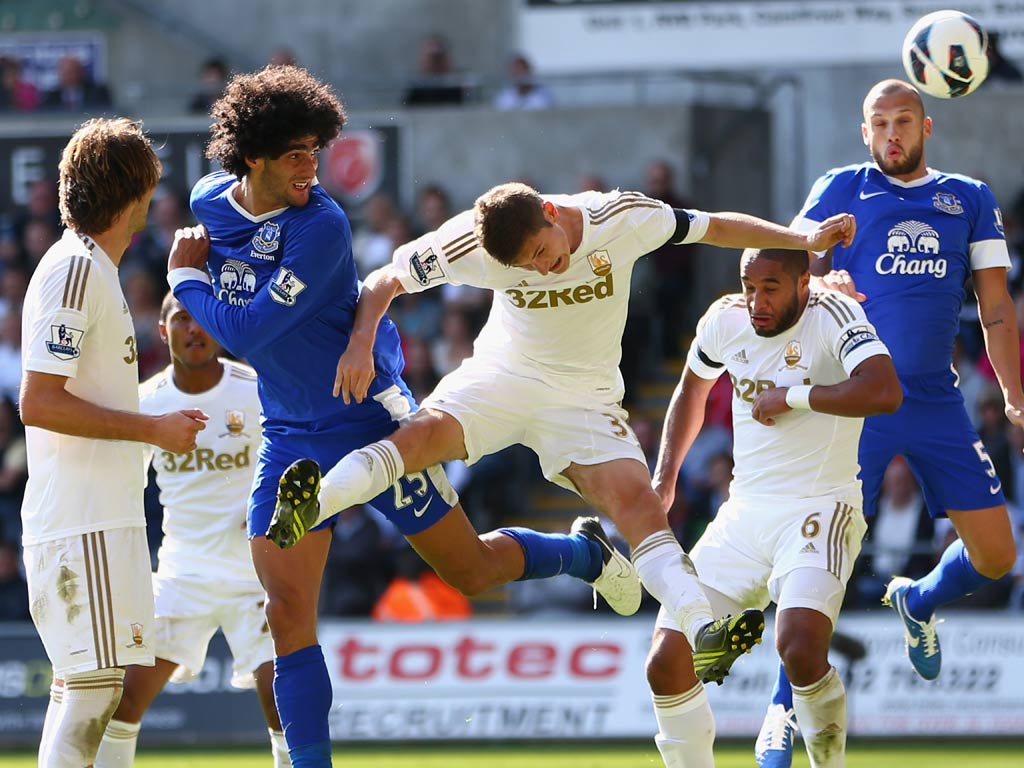 Everton midfielder Marouane Fellaini in action against Swansea