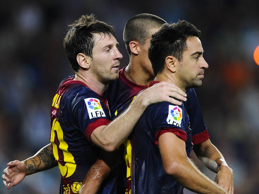 Lionel Messi congratulates Xavi