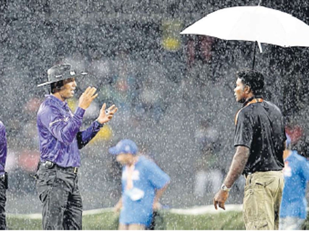 The umpires admit defeat and call off the match in the pouring rain of Colombo
