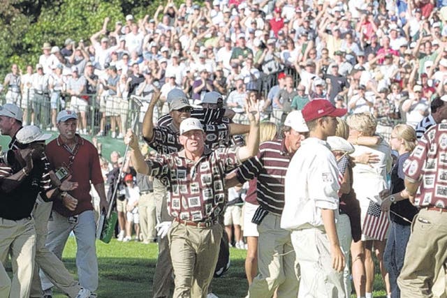 Jason Leonard tries to clear US team-mates and fans from the
green at Brookline in 1999