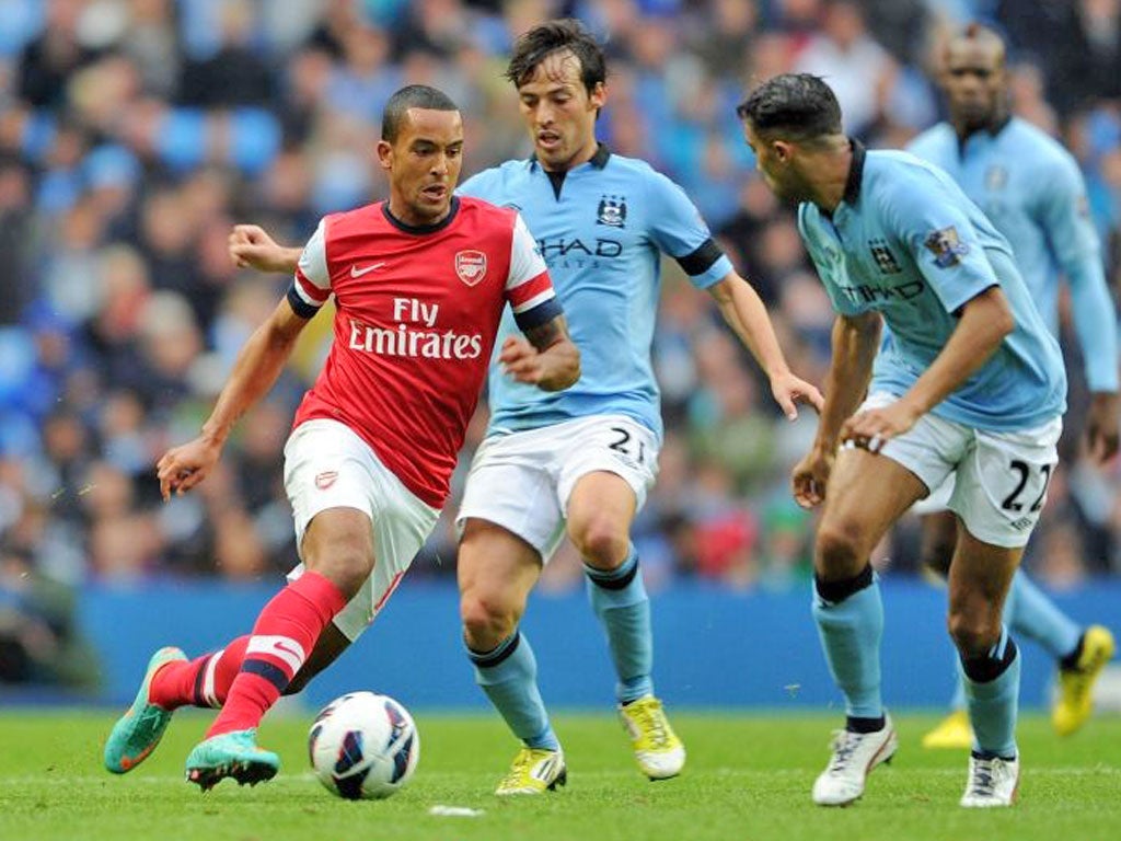 Theo Walcott in action against Manchester City on Sunday
