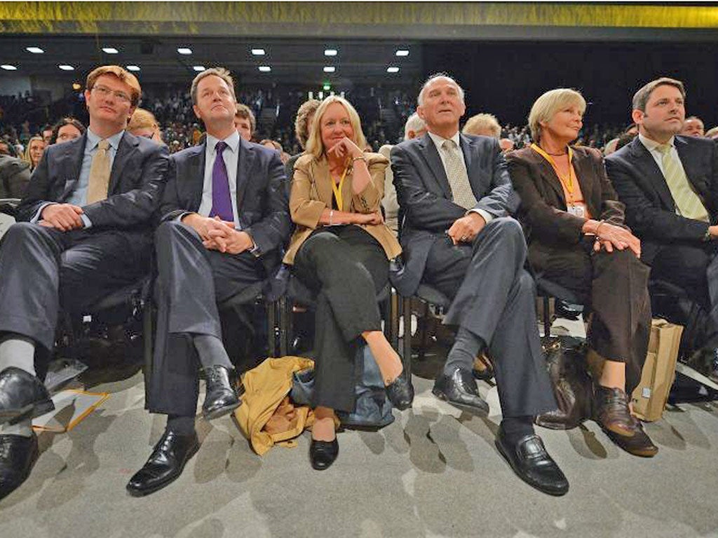 Nick Clegg listens to a speech at conference in Brighton with Lib
Dem colleagues Vince Cable and Danny Alexander