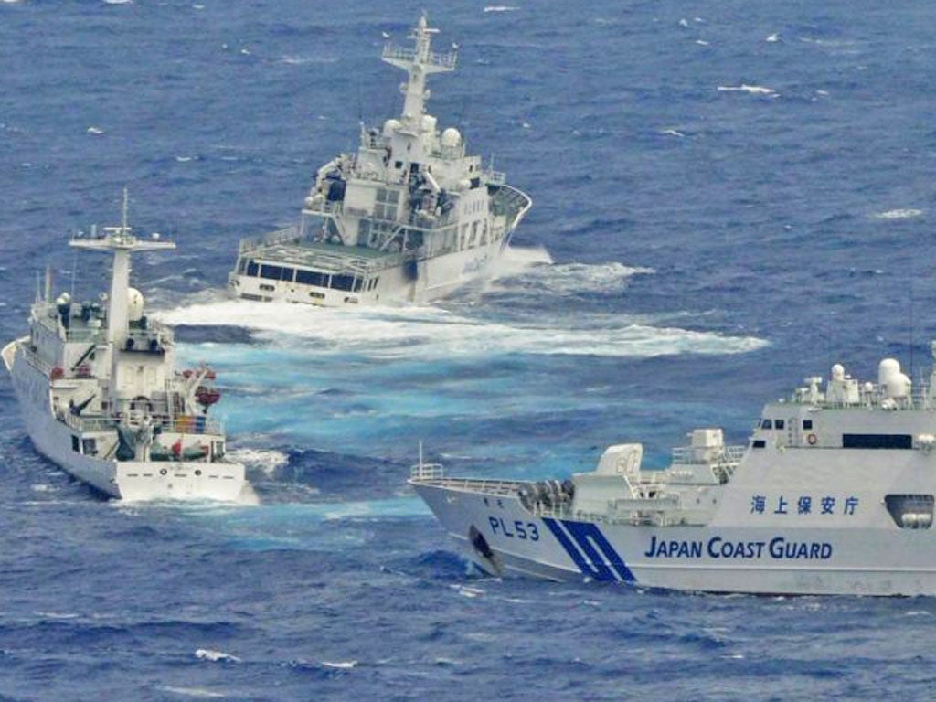 Japan Coast Guard vessels sail along with Chinese surveillance ship Haijian No. 66, near disputed islands called Senkaku in Japan and Diaoyu in China