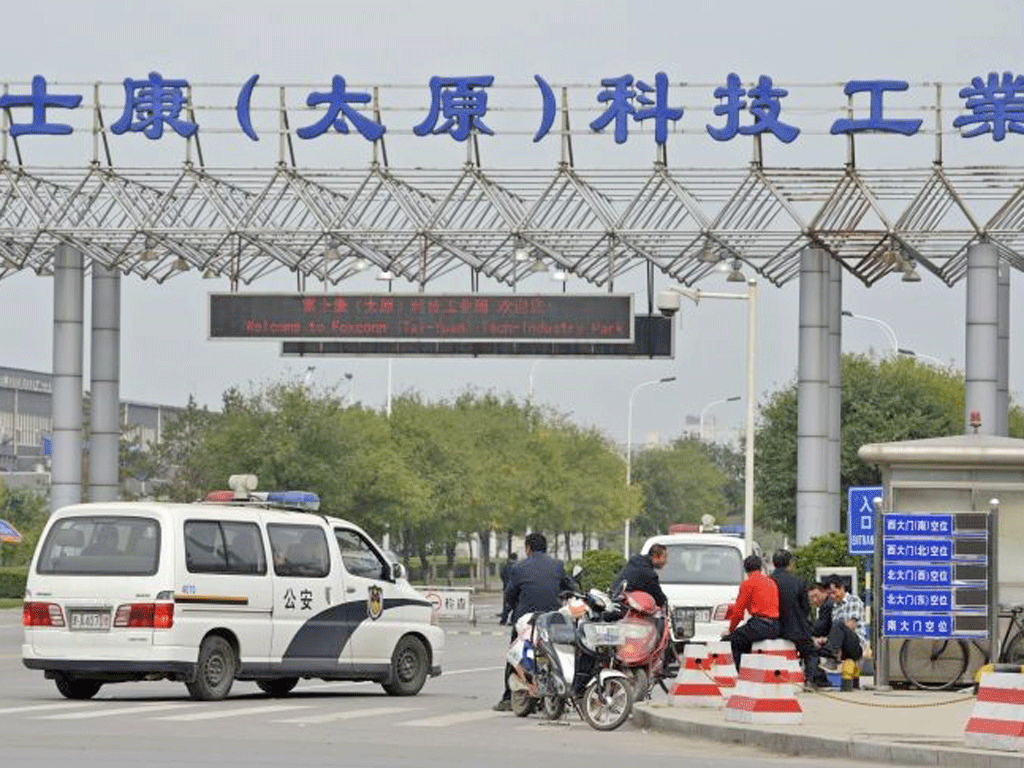 Police vehicles at the Foxconn plant in Taiyuan