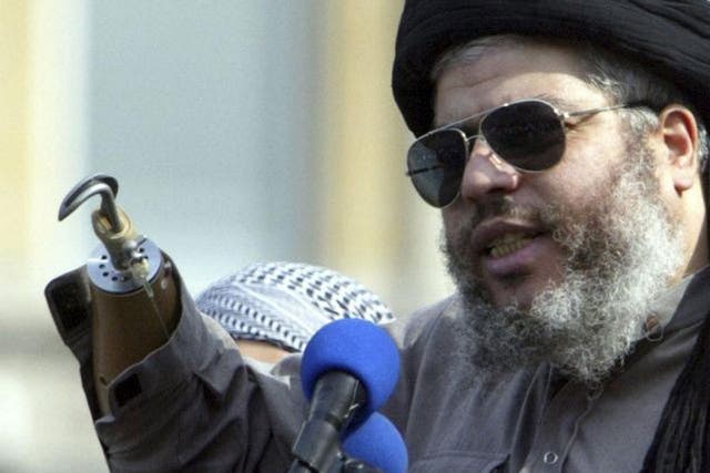 Muslim cleric, Abu Hamza al-Masri, is seen addressing the sixth annual rally for Islam in Trafalgar Square, London in this August 25, 2002 
