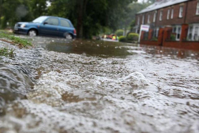 Flashback to 2012: Flood waters pours into a residential street after the River Wansbeck broke its banks in Morpeth