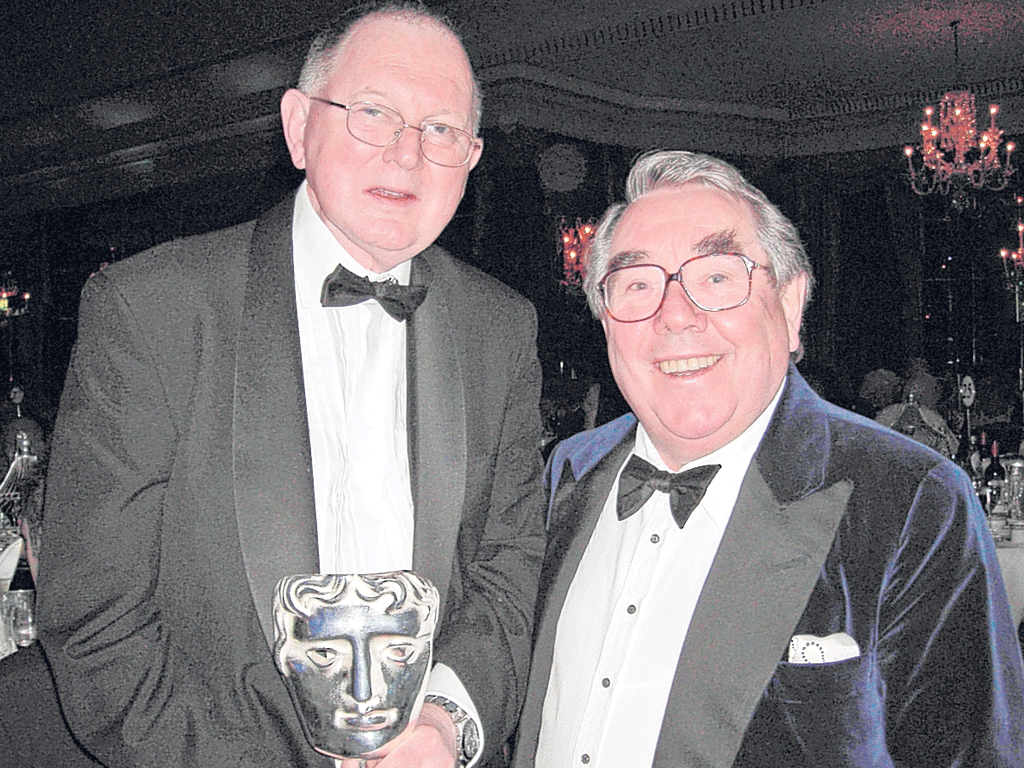 Hurll, left, with Ronnie Corbett and a Bafta;'they taught me everything,' he said of the two Ronnies