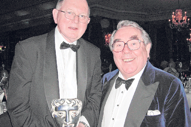 Hurll, left, with Ronnie Corbett and a Bafta;'they taught me everything,' he said of the two Ronnies