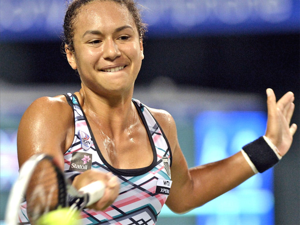 Heather Watson hits a return during her defeat by Maria Sharapova