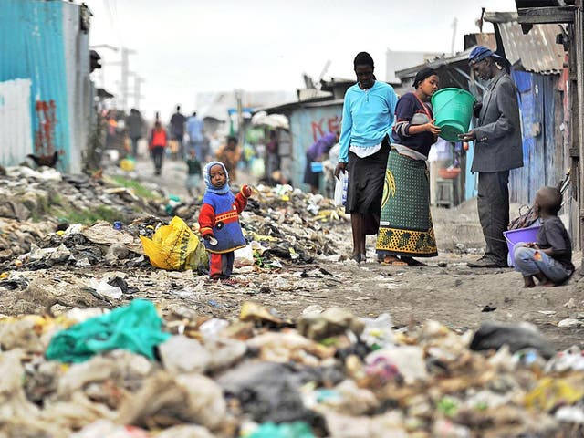 Residents in Nairobi's rubbish-strewn Mukuru slum