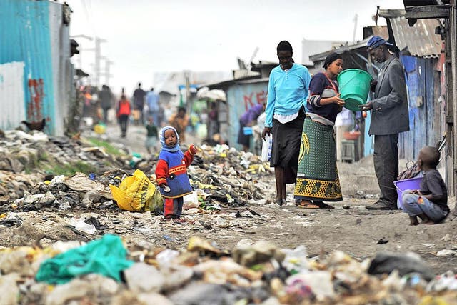 Residents in Nairobi's rubbish-strewn Mukuru slum