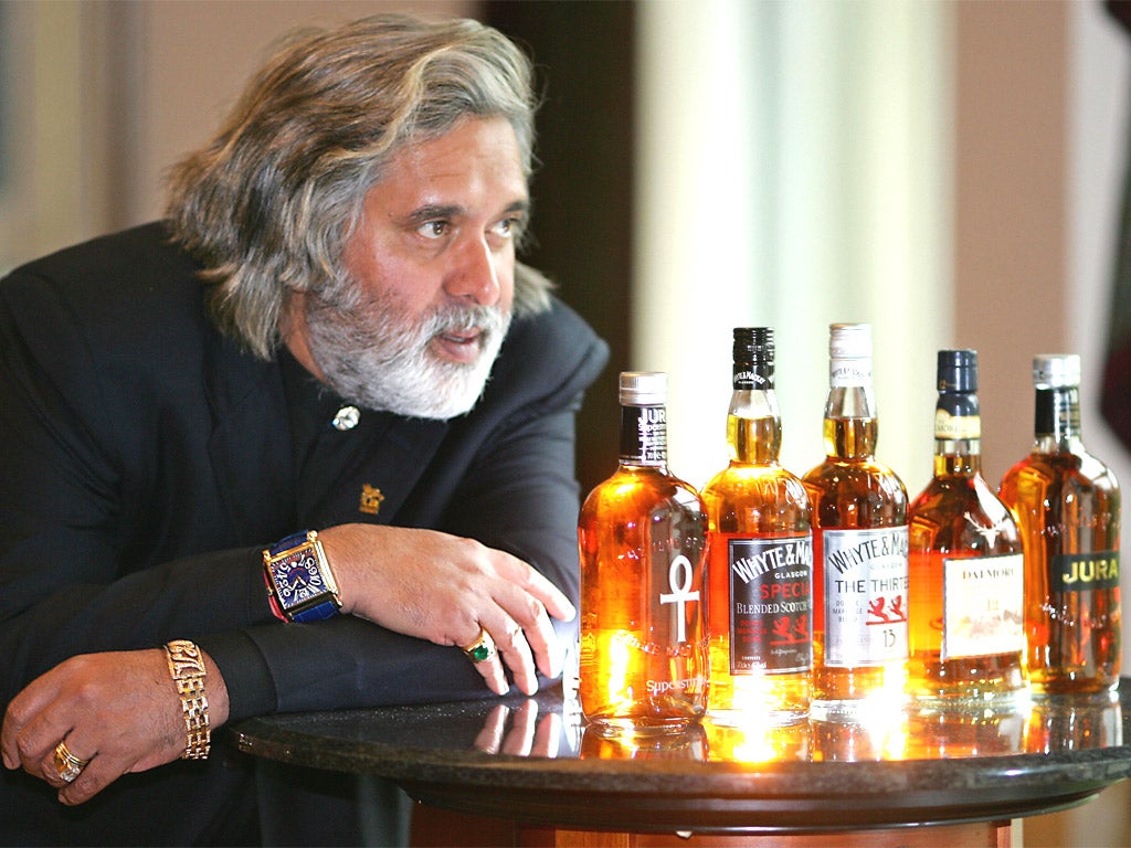 Vijay Mallya with some of his whisky brands