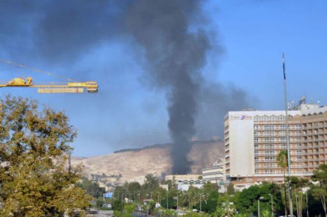 Columns of smoke rise from the site that has been hit by two powerful explosions in Damascus