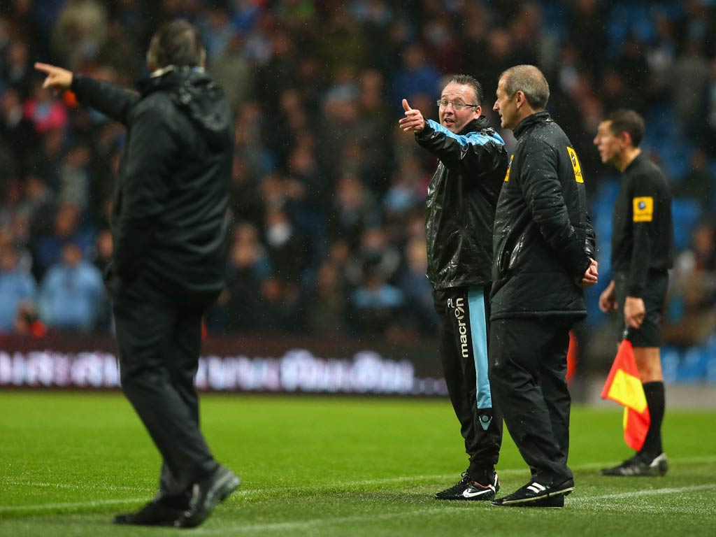 Roberto Mancini v Paul Lambert During Manchester City's surprise Capital One Cup defeat at home to Aston Villa, Roberto Mancini entered into an exchange with Paul Lambert when the latter seemed to object to the City manager questioning the fou