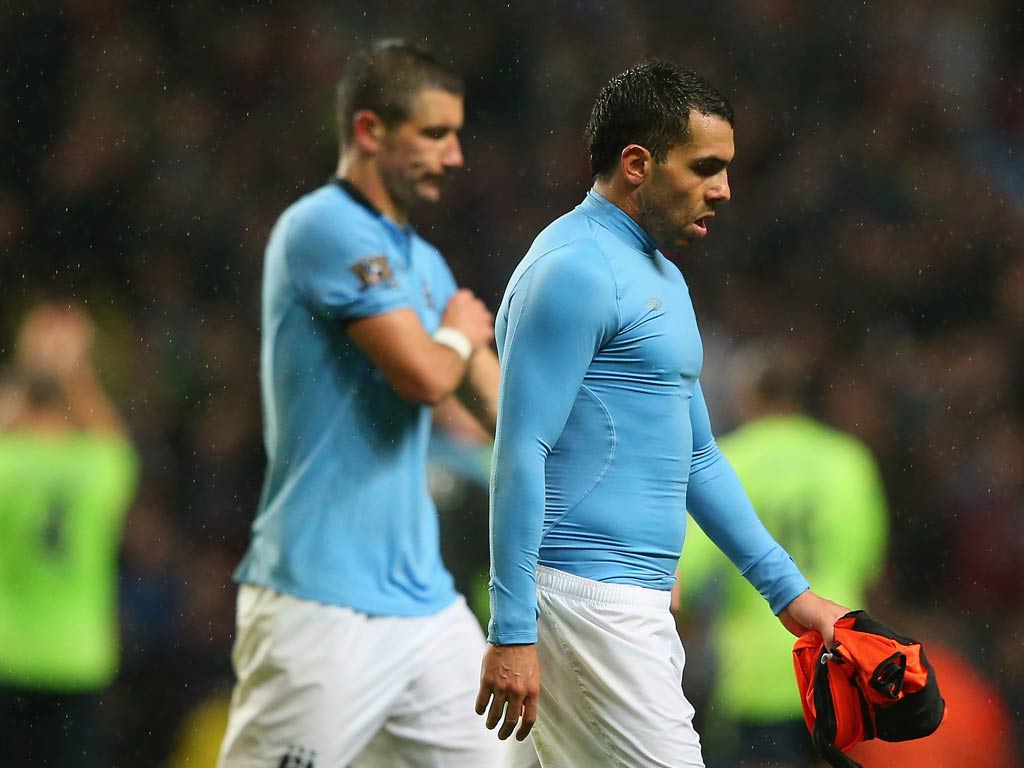 Manchester City striker Carlos Tevez leaves the field after defeat to Aston Villa