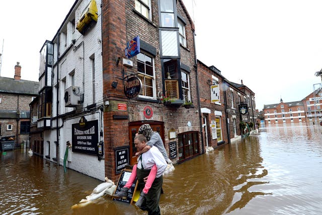 Floodwater sweeps through York city centre after the River Ouse burst its banks