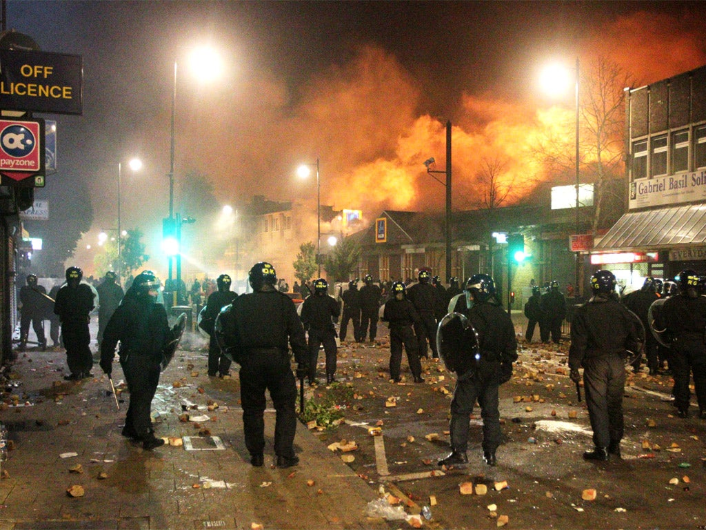Police officers on riot duty in Tottenham in the violent aftermath of the shooting of Mark Duggan