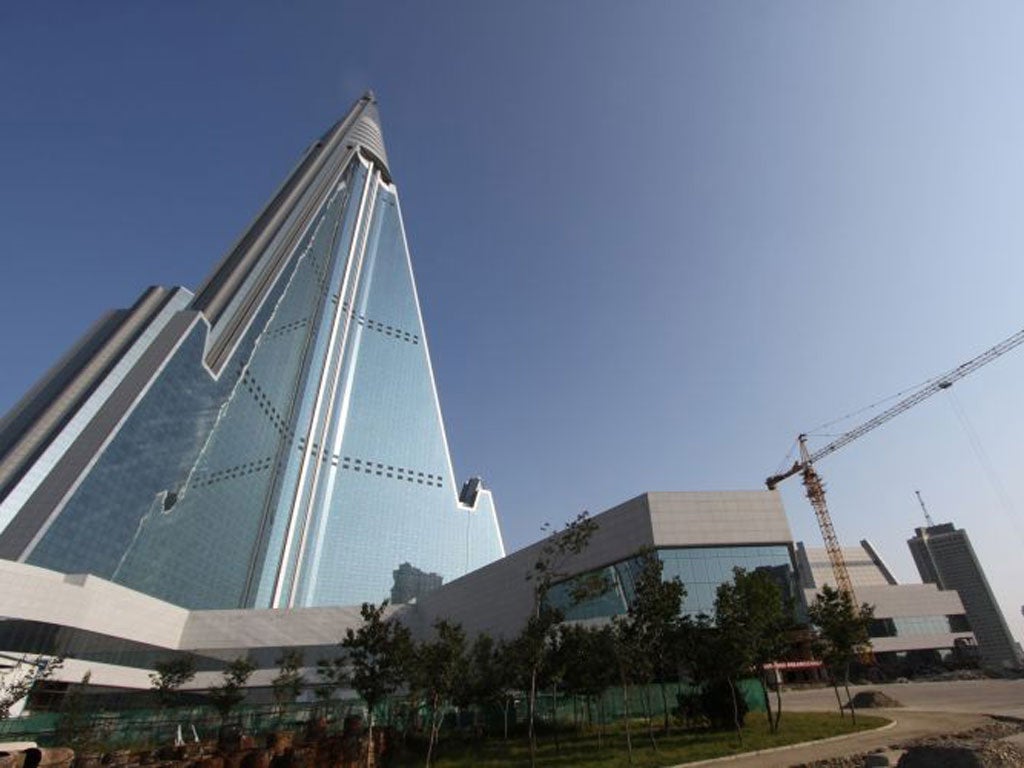 The pyramid-shaped 105-story Ryugyong Hotel stands in Pyongyang, North Korea.