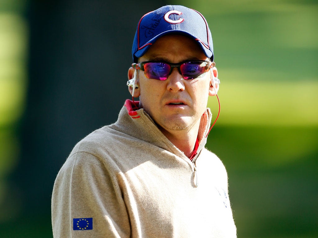 Ian Poulter dons a Chicago Cubs cap during practice at Medinah
