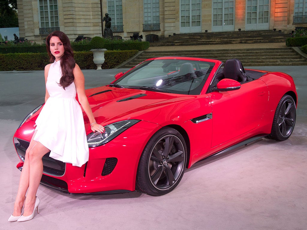 Looks good, sounds good: The F-type's launch in Paris this week was accompanied by Lana Del Rey, dedicating her new serenade, 'Burning Desire', to the car, with even her lipstick matched to the Jaguar's red paintwork. The song, and seven other trac
