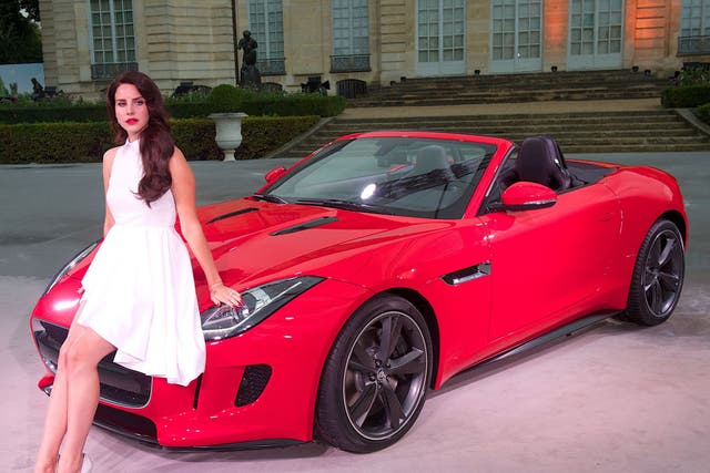 <b>Looks good, sounds good:</b> The F-type's launch in Paris this week was accompanied by Lana Del Rey, dedicating her new serenade, 'Burning Desire', to the car, with even her lipstick matched to the Jaguar's red paintwork. The song, and seven other trac