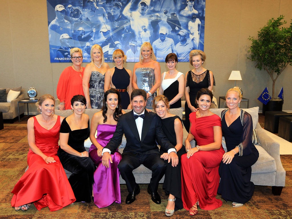 Europe team captain Jose Maria Olazabal posing with the wives of the golf players