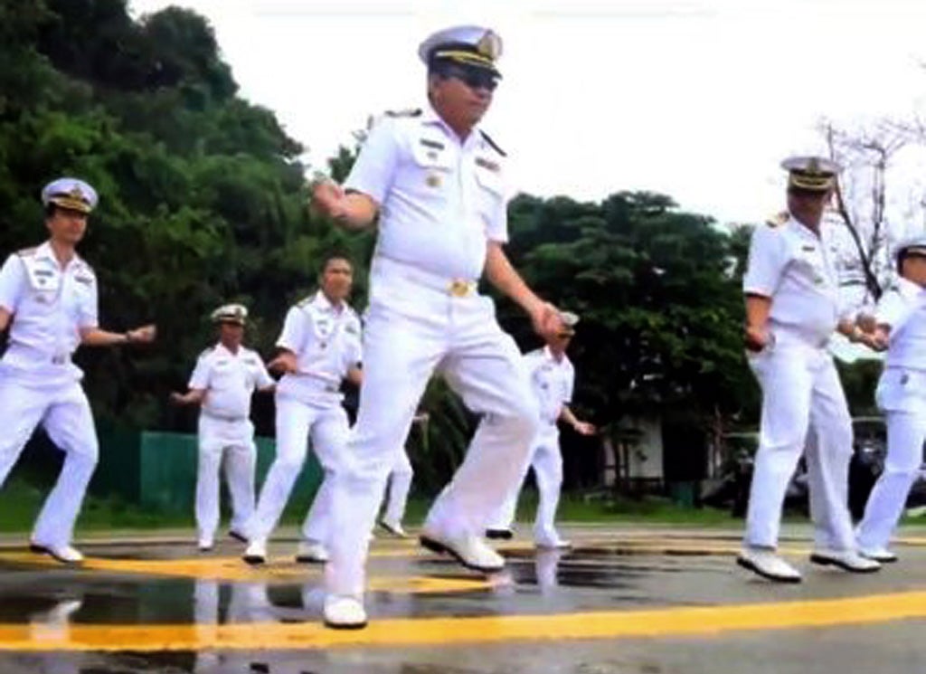 In this image made from an undated video released by Thai Royal Navy, Thai sailors perform the rodeo-style dance and other hip-shaking moves at their base on the popular tourist island of Phuket, southern Thailand.