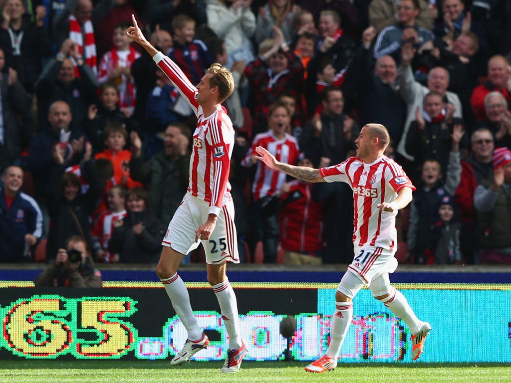 Peter Crouch (L) of Stoke City celebrates scoring his second goal with Michael Kightly (R)