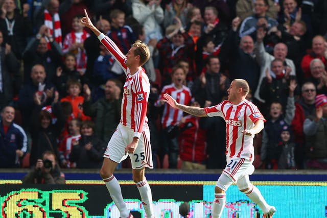 Peter Crouch (L) of Stoke City celebrates scoring his second goal with Michael Kightly (R)